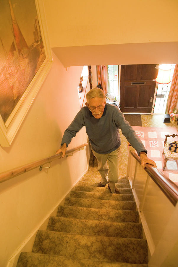 Elderly Man Climbing Stairs Photograph by Mary Dunkin/science Photo Library