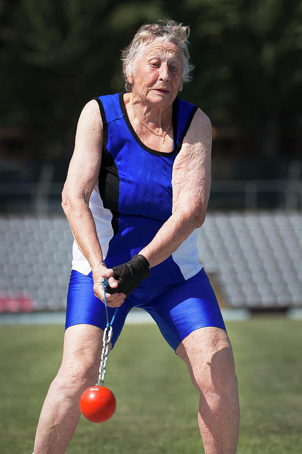 Elderly Woman Competitive Weights Thrower Photograph by Alex Rotas