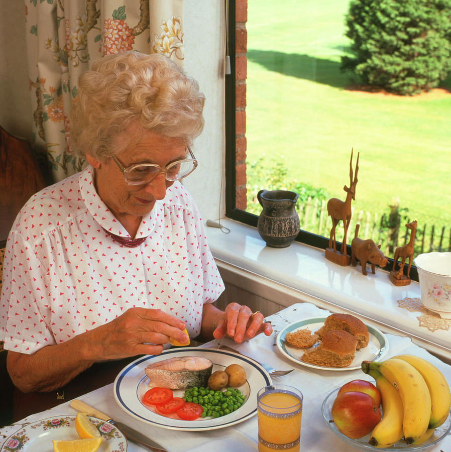 Elderly Woman Eating Healthy Meal Photograph by Sheila Terry/science ...