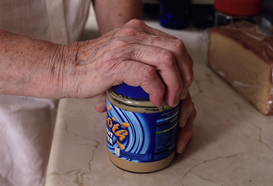 Elderly Woman Opening Jar Photograph by Jerry Mason/science Photo Library