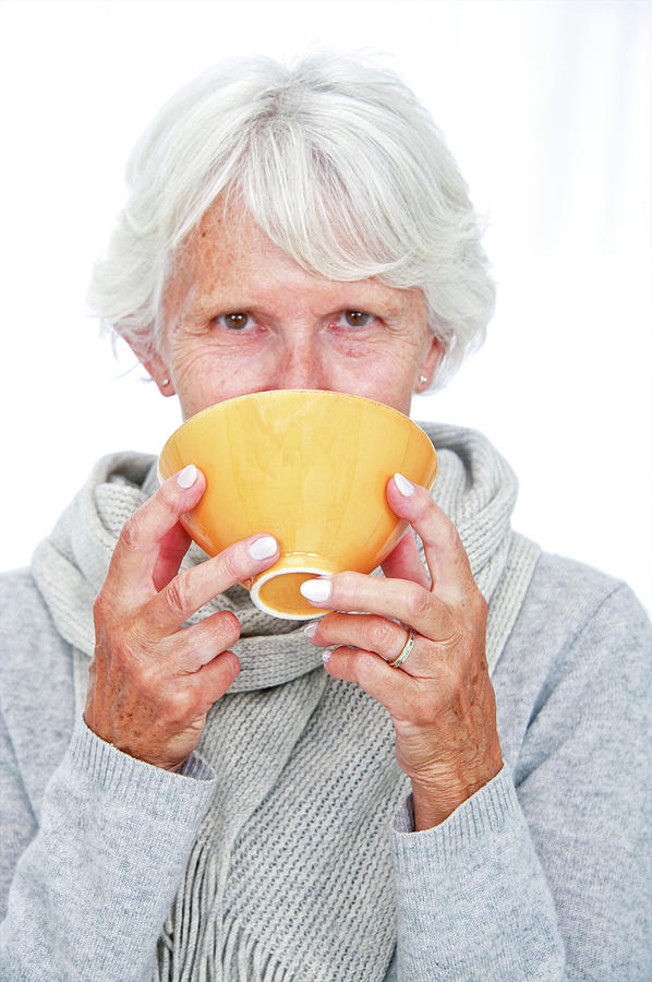 Elderly Woman With A Hot Drink Photograph by Lea Paterson