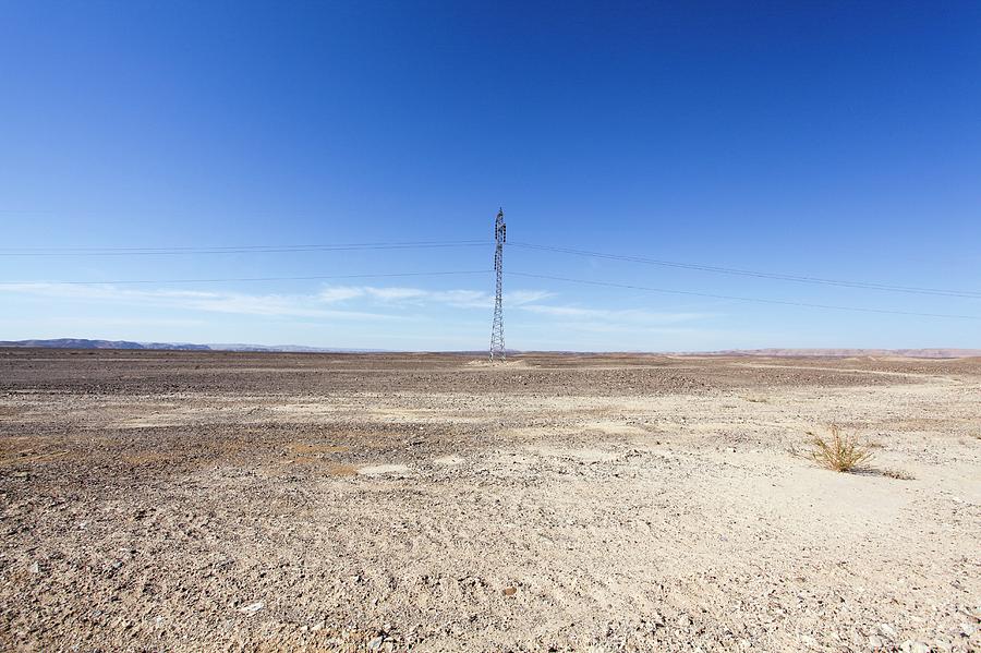 Electricity Pylon In Desert Photograph by Photostock-israel