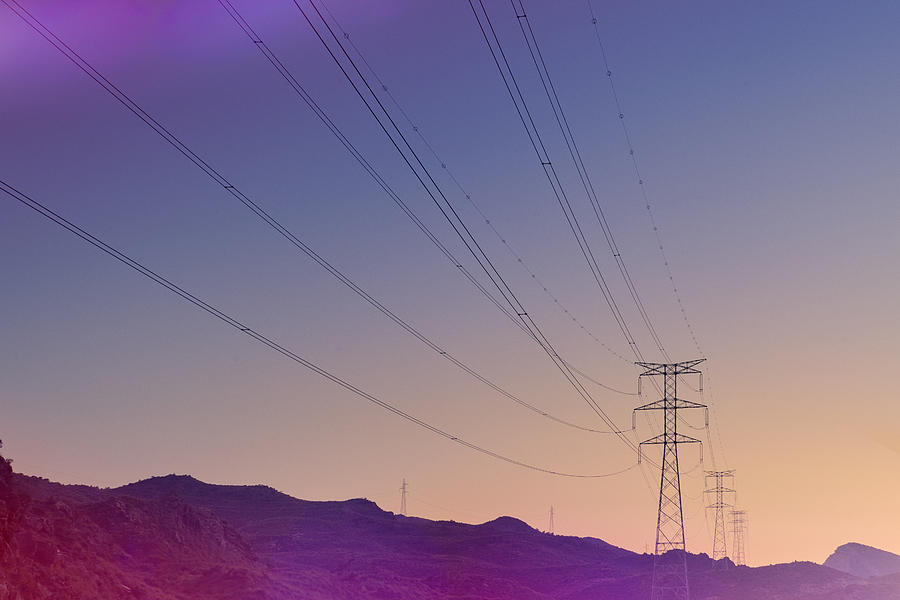Electricity pylons at sunset Photograph by James ONeil