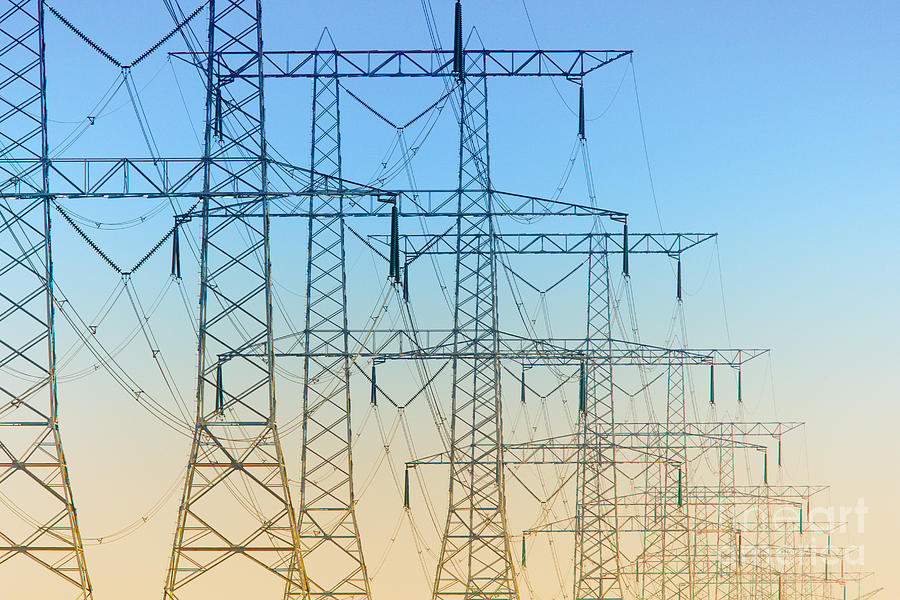 Electricity Pylons Standing In A Row Photograph