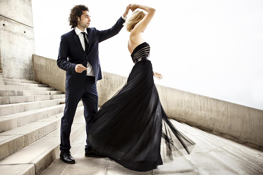 Elegant couple dancing together Photograph by Orbon Alija