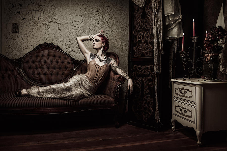 Elegant Retro Woman Lounging on Couch Photograph by Redhumv
