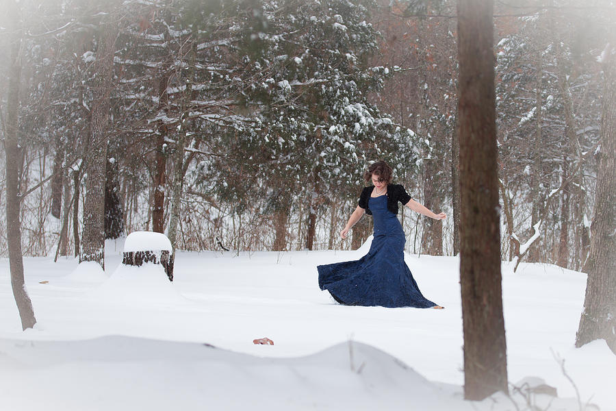 Winter Photograph - Elegant Woman Walking in Snow by Veda Gonzalez