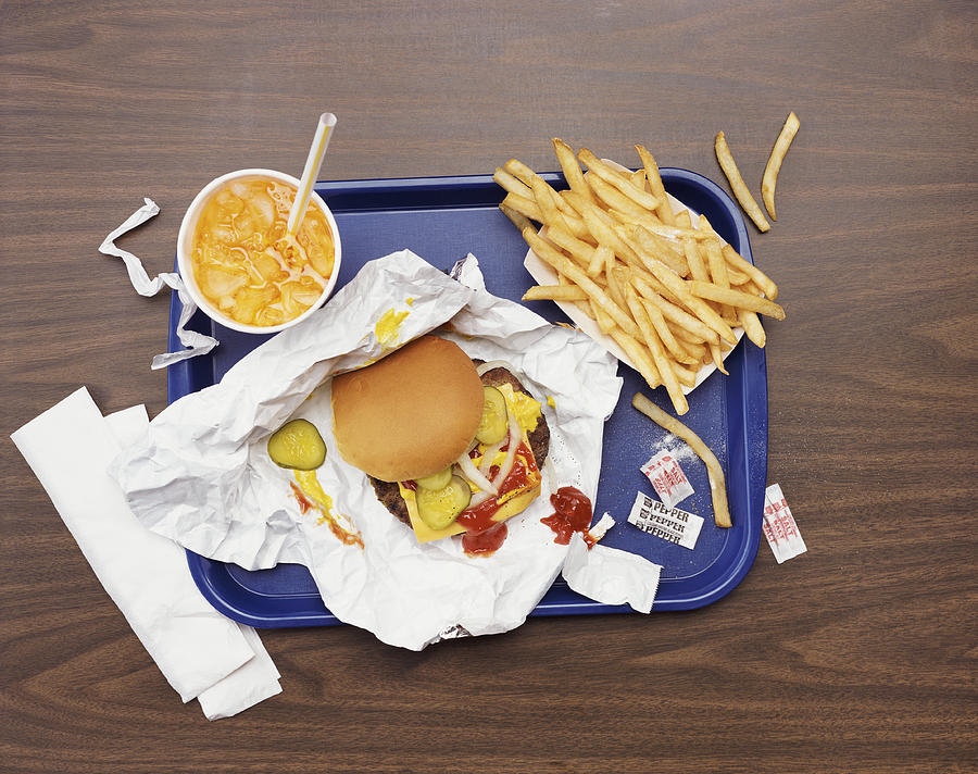 Elevated View of a Tray With Fries, a Hamburger and Lemonade Photograph by Digital Vision.