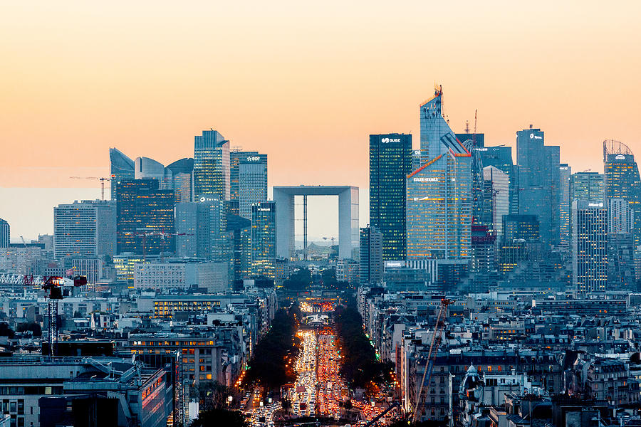 Elevated view of illuminated skyscrapers at La Defense financial district and Avenue des Champs-Elysees at dusk, Paris, France Photograph by Alexander Spatari