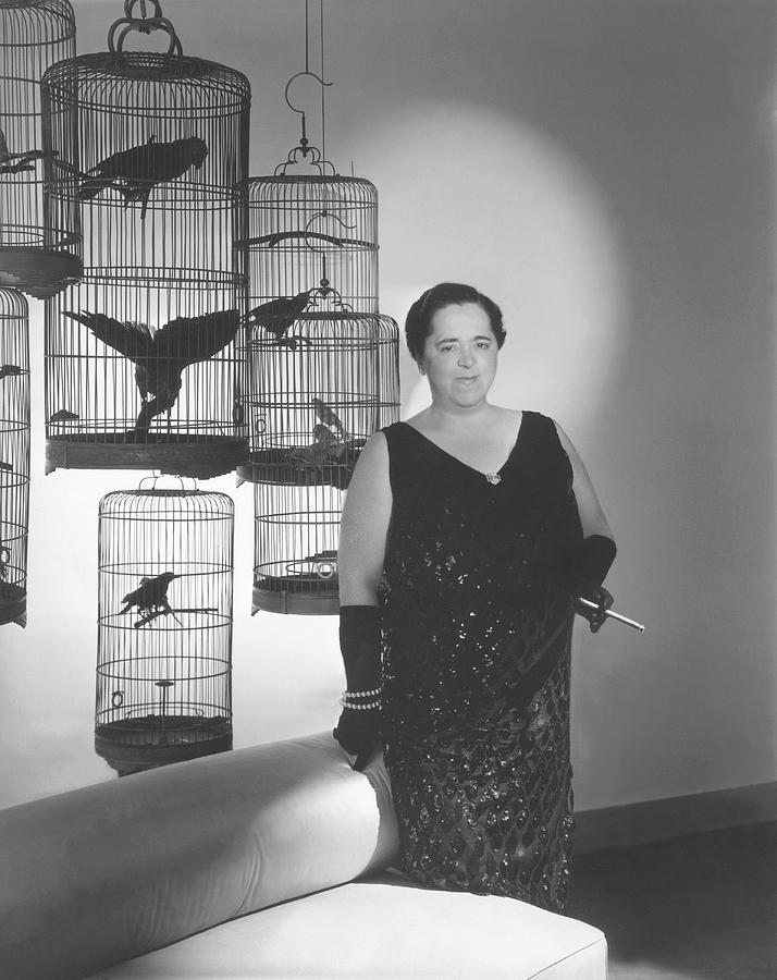 Elsa Maxwell Posing In Front Of Bird Cages Photograph by Horst P. Horst