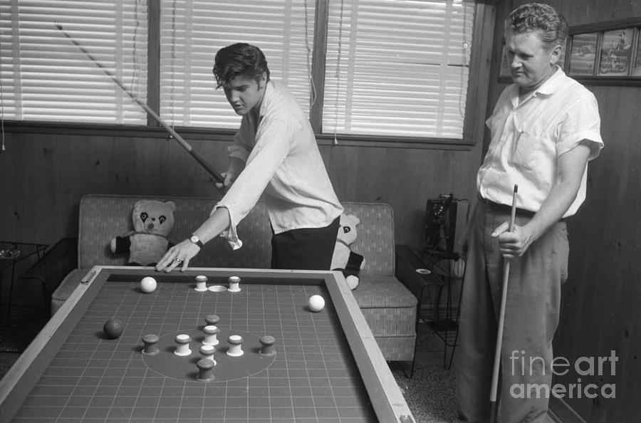 Elvis Presley Photograph - Elvis Presley and Vernon Playing Bumper Pool 1956 by The Harrington Collection