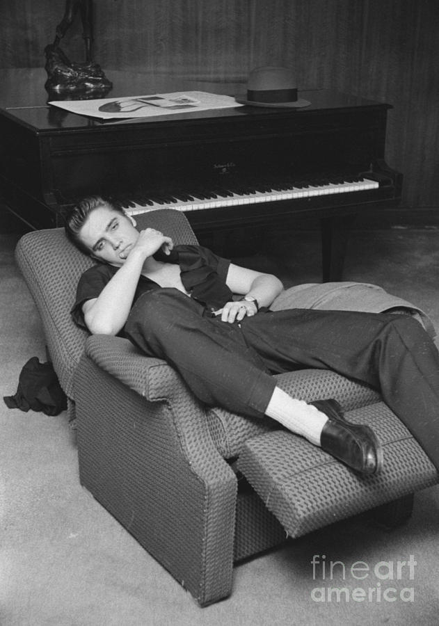 Elvis Presley Photograph - Elvis Presley at home by his piano 1956 by The Harrington Collection