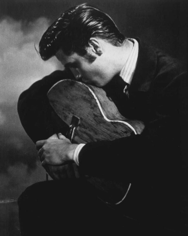 Classic Photograph - Elvis Presley Kisses Guitar by Retro Images Archive