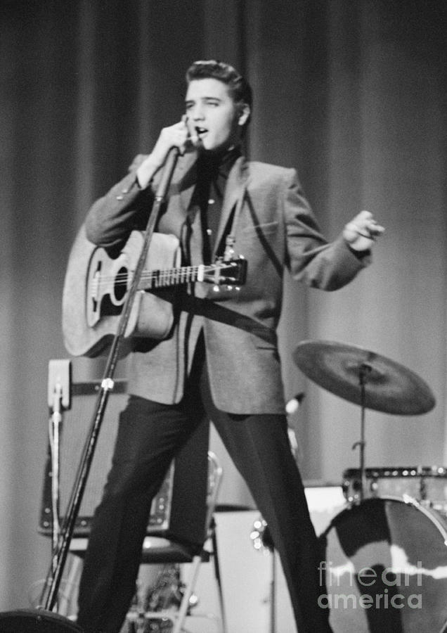 Elvis Presley Photograph - Elvis Presley on stage 1956 by The Harrington Collection