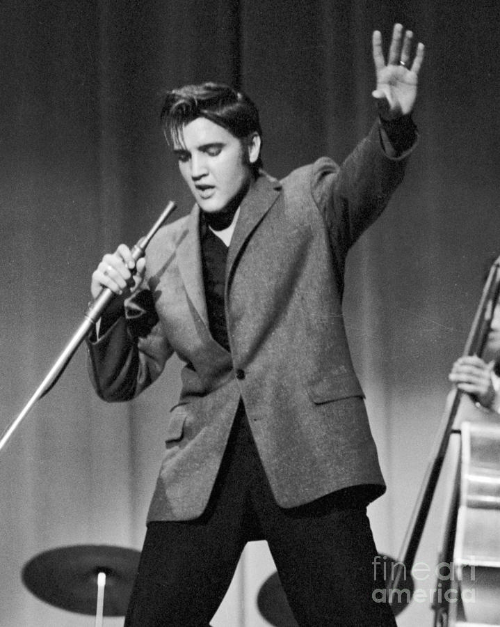 Elvis Presley performing in 1956 Photograph by The Harrington Collection