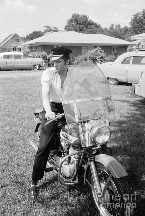 Elvis Presley with his 1956 Harley KH and his Cadillacs Photograph by The Harrington Collection