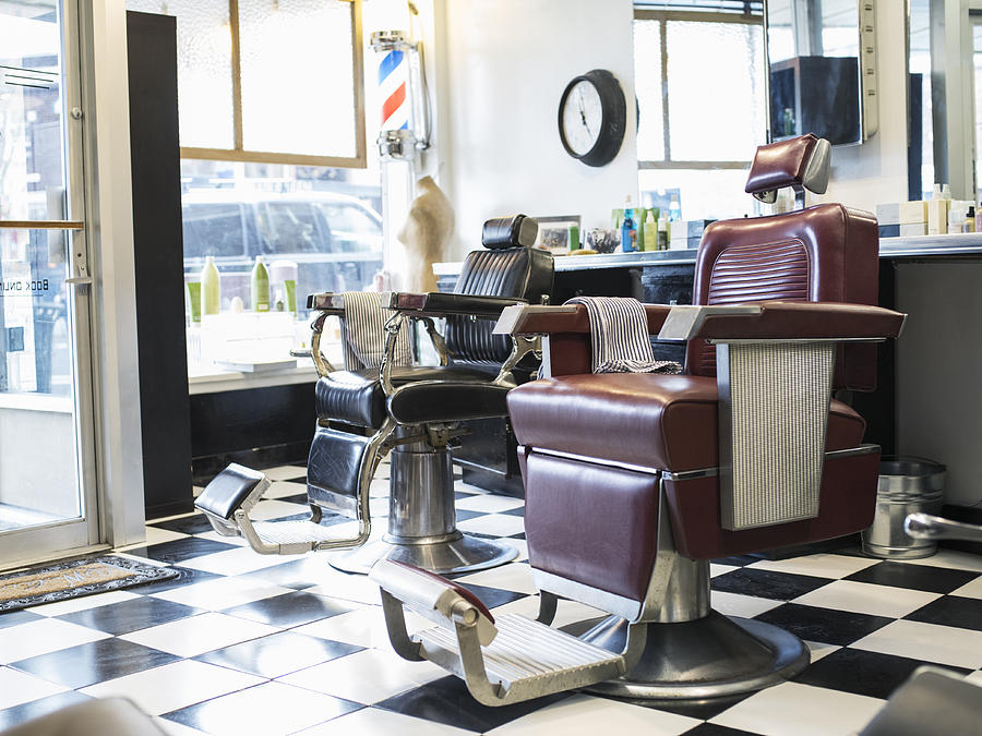 Empty chairs in retro barbershop Photograph by Jetta Productions Inc