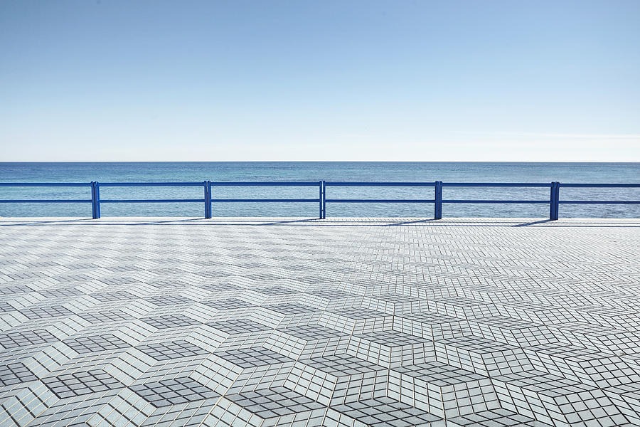 Empty Coastal boardwalk with geometric tile pattern, Alicante, Spain Photograph by James ONeil