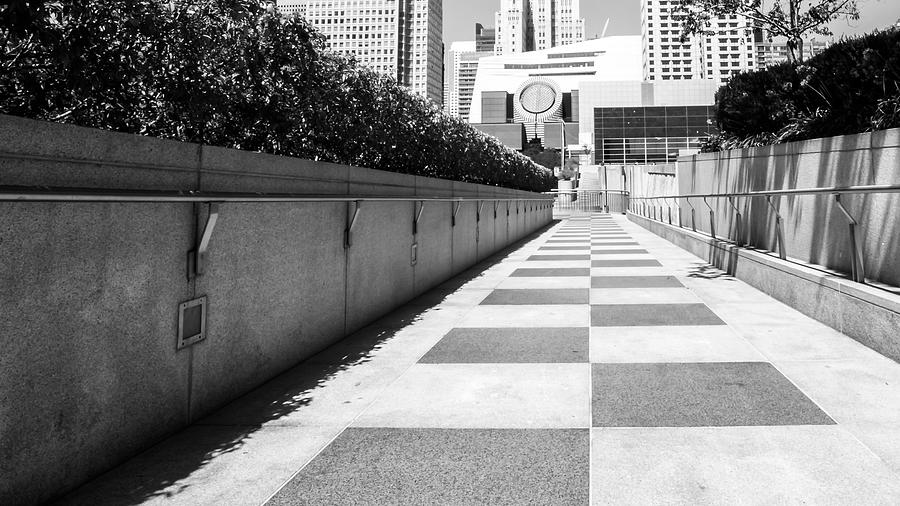 Empty Footpath Leading Towards Buildings On Sunny Day Photograph by Jesse Coleman / EyeEm