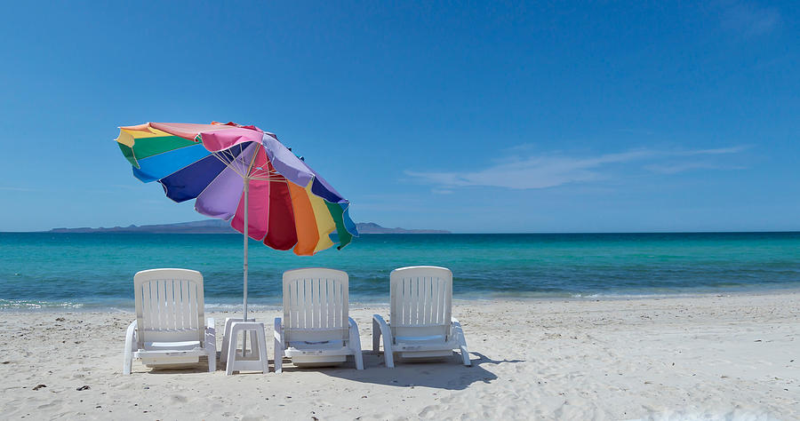 Empty Lounge Chairs And Umbrella At Beach Against Blue Sky Photograph by Jesse Coleman / EyeEm Empty Lounge Chairs And Umbrella At Beach Against Blue Sky Photograph by Jesse Coleman / EyeEm