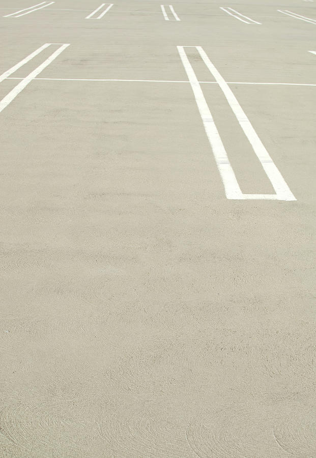 Empty Parking Lot Spaces Photograph by Pete Starman