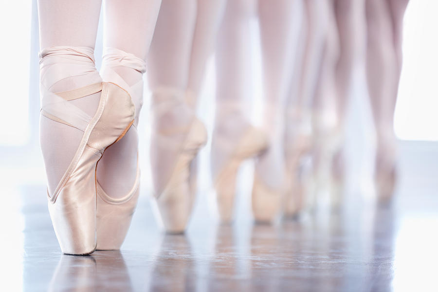 En pointe in a row Photograph by PeopleImages