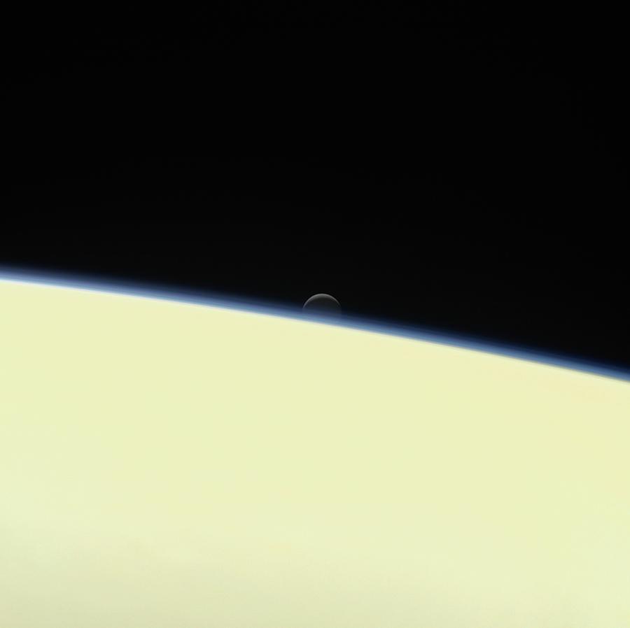 Enceladus Setting Behind Saturn Photograph by Nasa/jpl-caltech/space Science Institute/science Photo Library