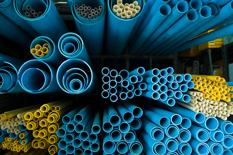 End-view of groups of different sized blue and yellow tubes Photograph by Sndrk