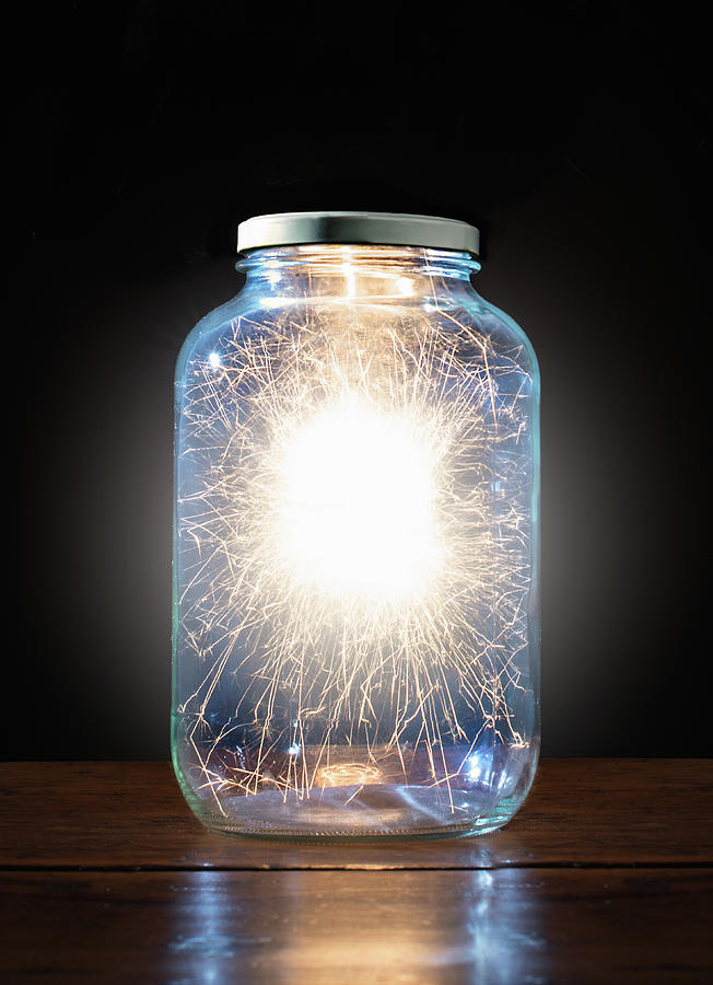 Energy Trapped In Jar Photograph by Pm Images