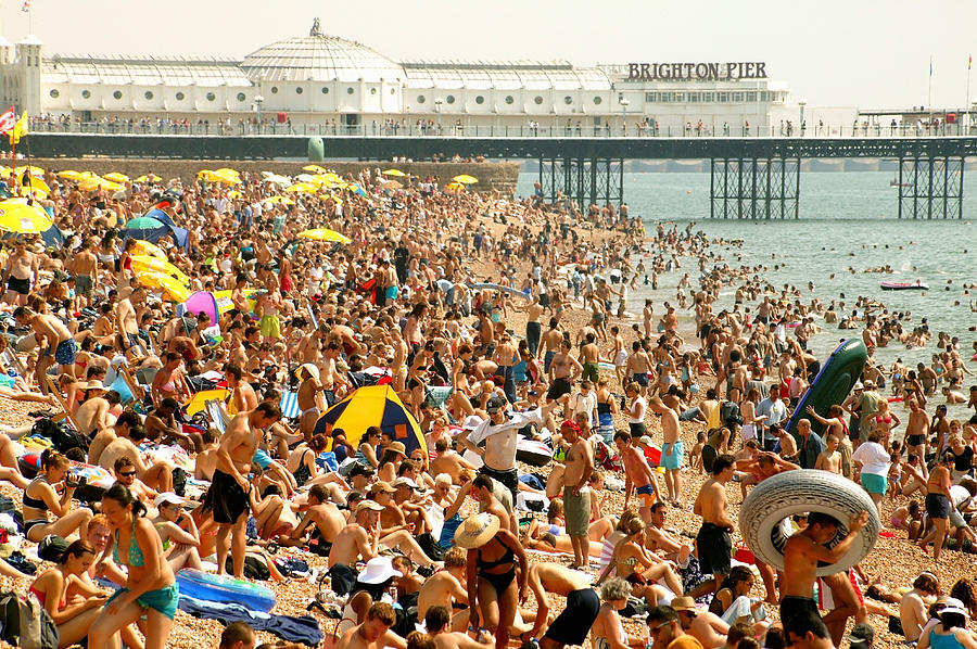England, Brighton, crowded beach, summer Photograph by Michael Dunning