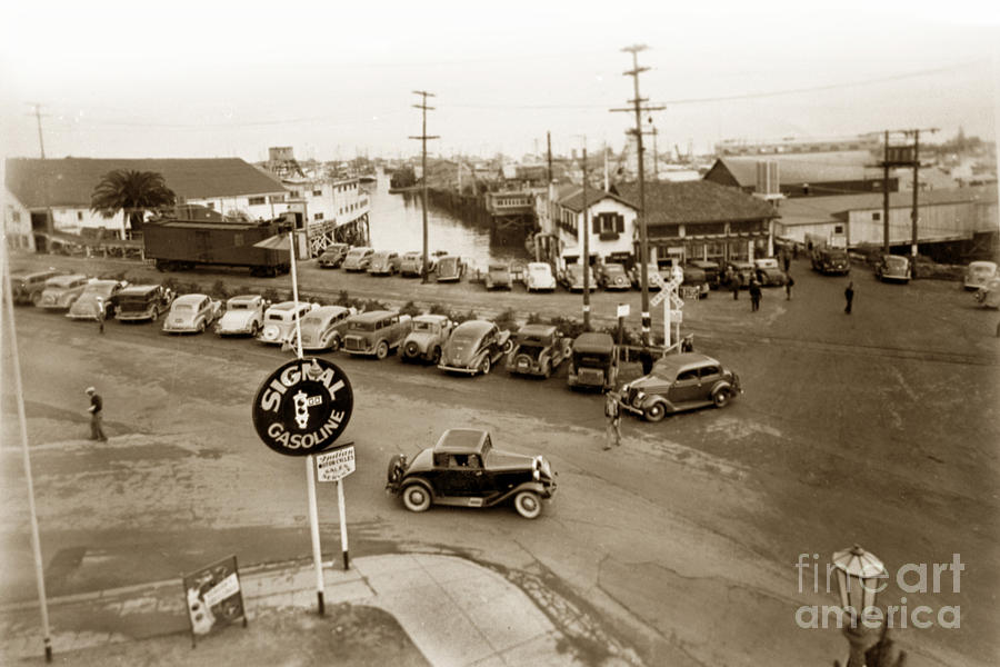 Monterey Photograph - Entrance to Monterey Fishermens Wharf and Booth Cannery circa 1935 by Monterey County Historical Society