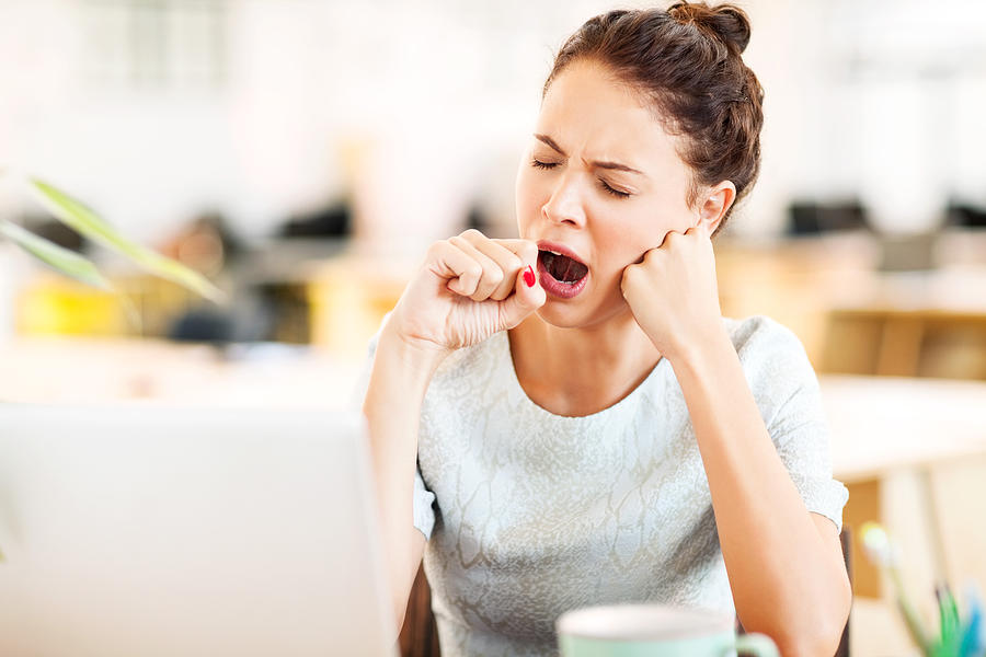 Entrepreneur Yawning In Office Photograph by Neustockimages