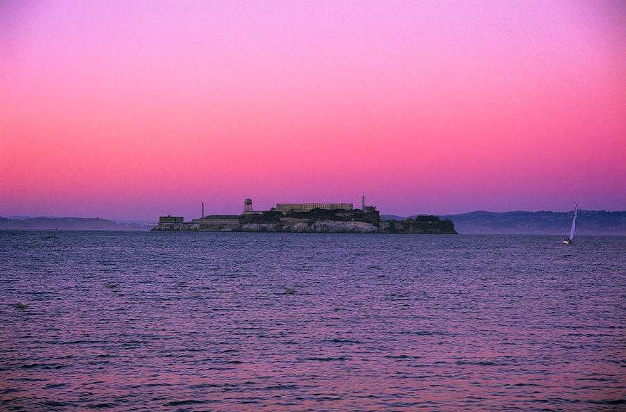 Escape from Alcatraz Under a Pink Sunset in a Sailboat Photograph by Jeremy Herman