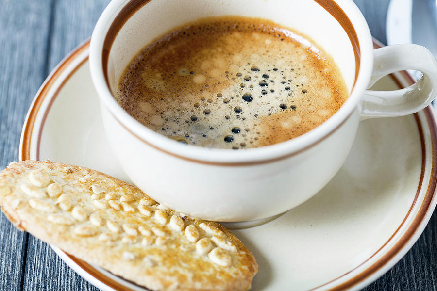 Espresso In Coffee Cup With Biscuit Photograph by Wladimir Bulgar/science Photo Library
