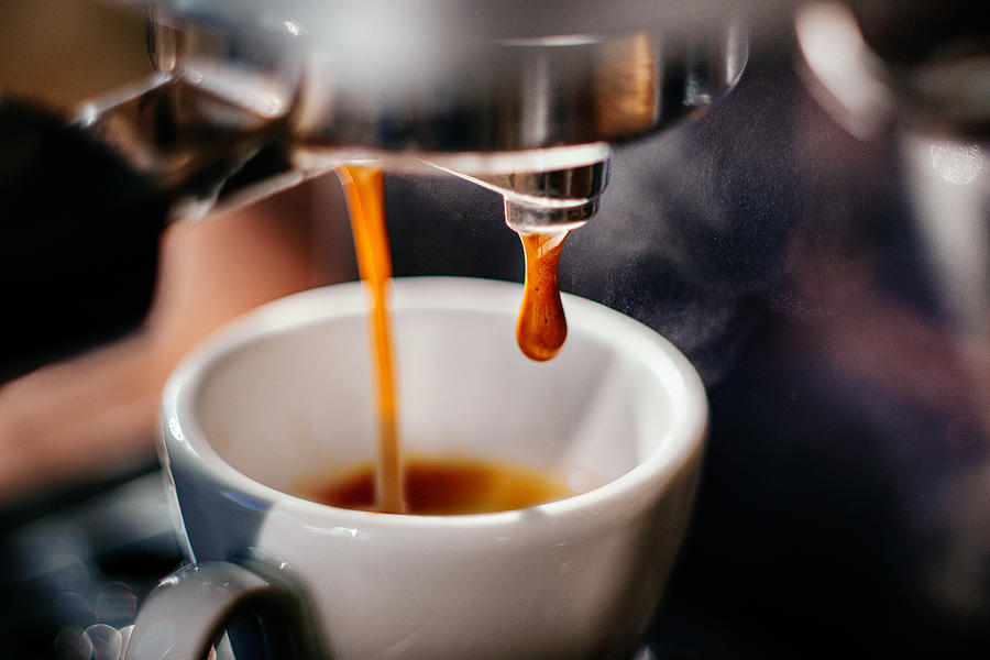 Espresso shot pouring out. Photograph by Guido Mieth