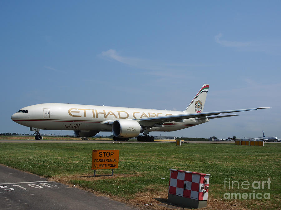 Transportation Photograph - Etihad Airways Boeing 777 by Paul Fearn