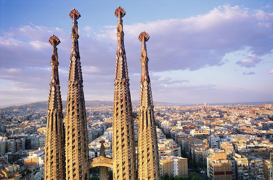Europe, Spain, Barcelona, Spires of Sagrada Familia and skyline Photograph by Peter Adams