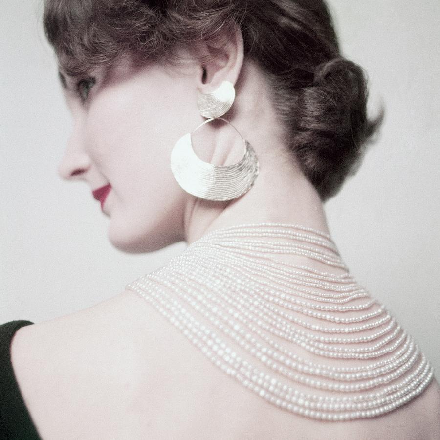 Evelyn Tripp Wearing A Necklace And Earring Photograph by Richard Rutledge