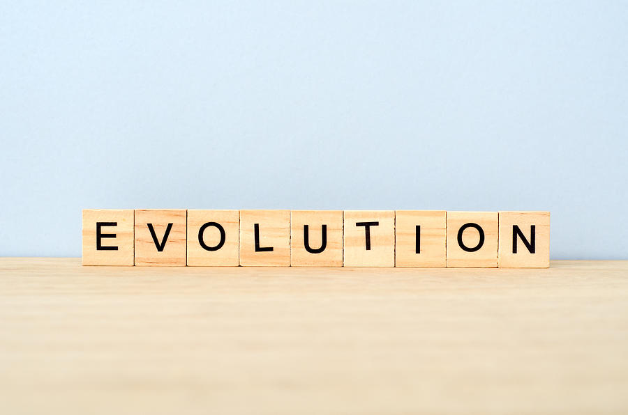Evolution Word on Wooden Tile Block Photograph by Nora Carol Photography