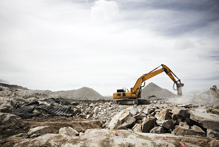 Excavator on construction site Photograph by Johner Images