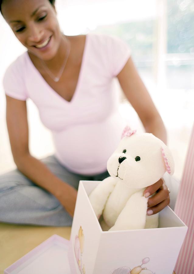 Expectant Mother Opening Baby Presents Photograph by Ian Hooton/science Photo Library