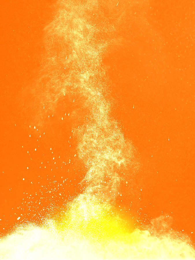 Explosion of a cloud of powder of particles of colors white and yellow and a orange background Photograph by Jose A. Bernat Bacete