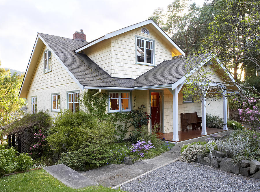 Exterior of cottage style house with front yard Photograph by Ivan Hunter