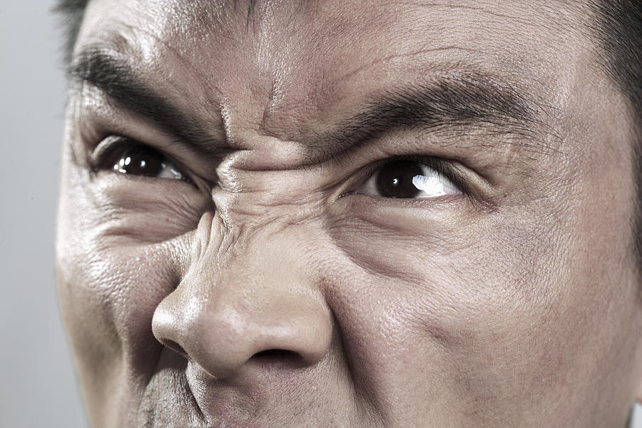 Extreme Close up on angry mans face Photograph by XiXinXing
