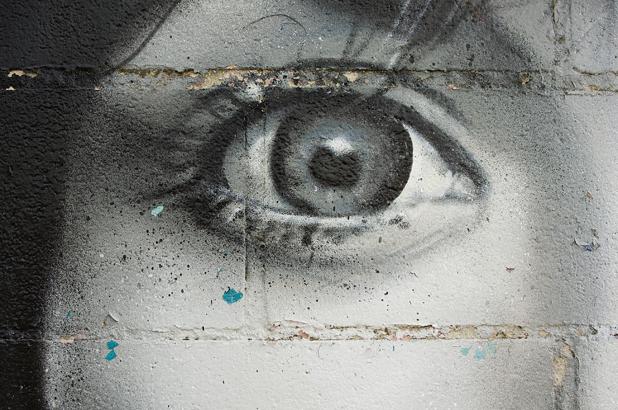 Eye on the wall Photograph by Tulla