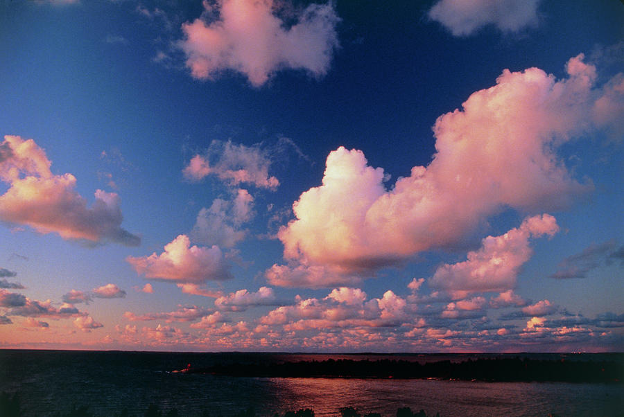 Fair-weather Cumulus Clouds Over Water At Sunset Photograph by Pekka Parviainen/science Photo Library