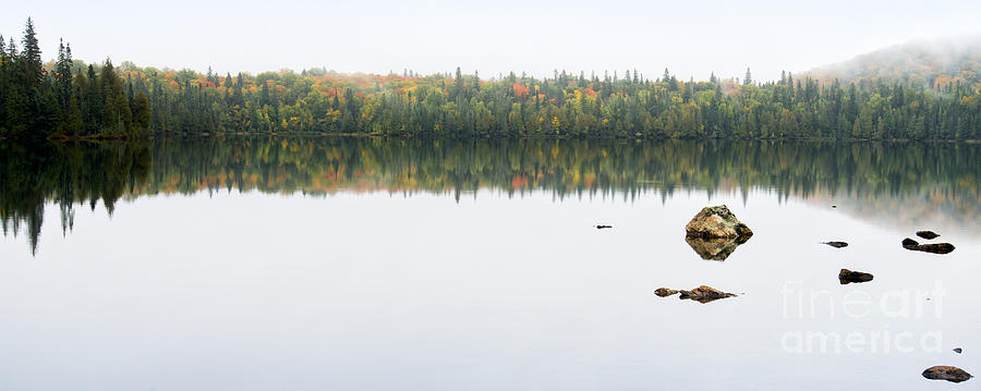 Fall colors on a calm lake in northern Ontario Photograph by Les Palenik
