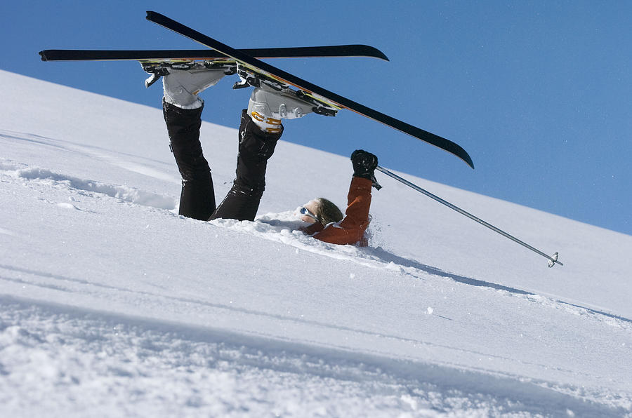Fallen skier lying in powder snow Photograph by Adie Bush