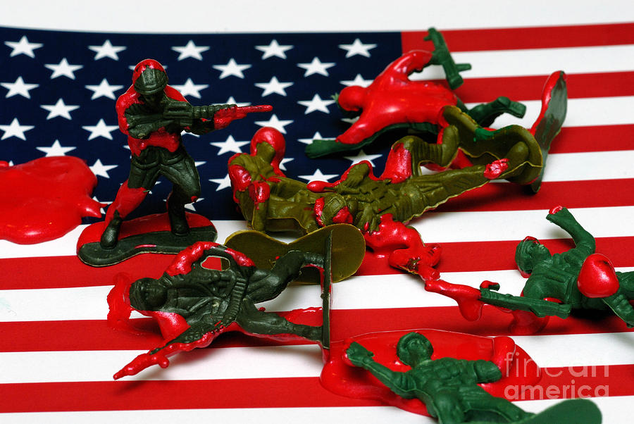 Toy Photograph - Fallen Toy Soliders on American Flag by Amy Cicconi