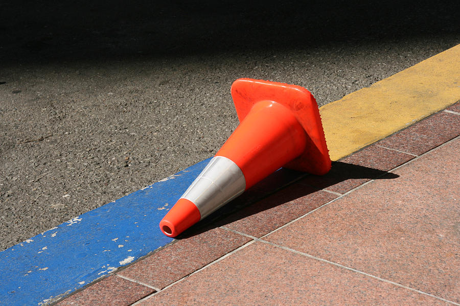 Fallen traffic cone on street Photograph by Image by Marie LaFauci